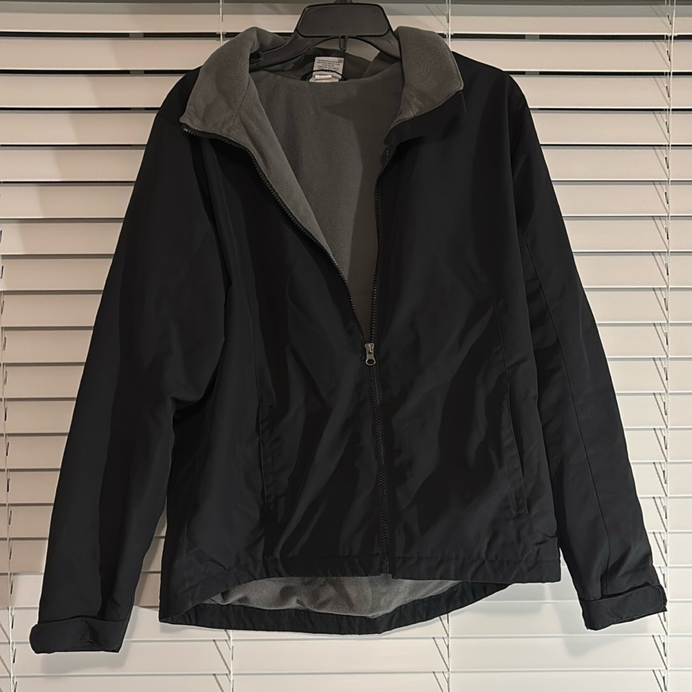 Black Magellan rain coat with detachable hood.